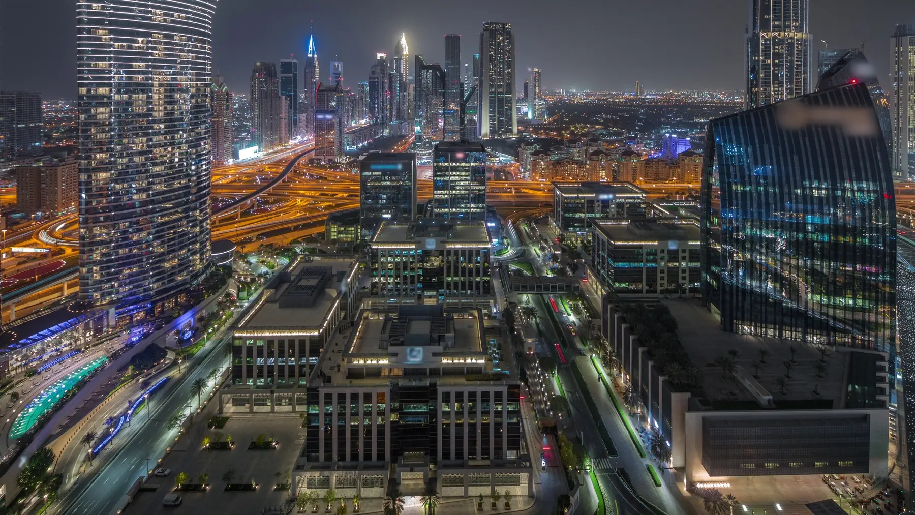Dubai business district illuminated at night